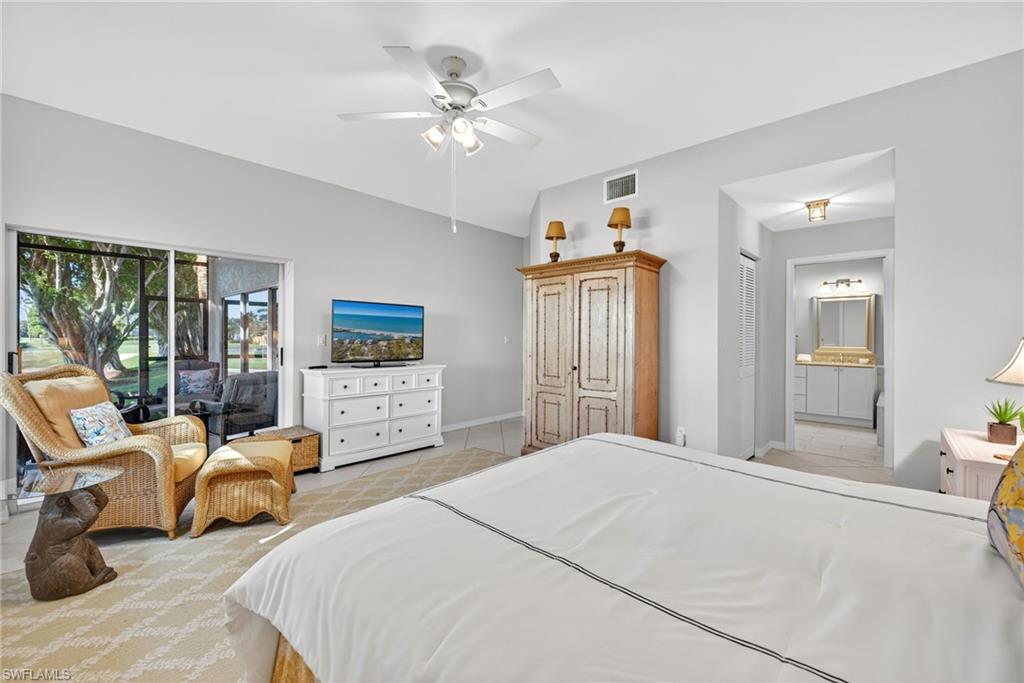 2193 Paget Circle, Unit 1 25 Naples, FL 34112 - Photo 18 of 50 a bedroom with furniture and large windows