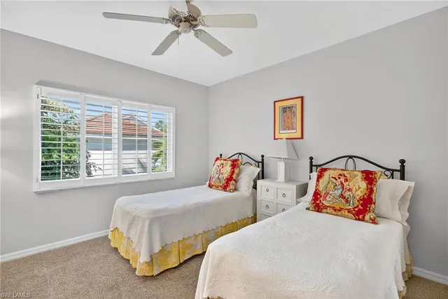 a bathroom with a toilet sink vanity and mirror