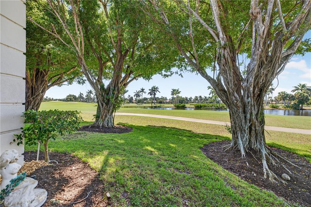 2193 Paget Circle, Unit 1 25 Naples, FL 34112 - Photo 30 of 50 a view of a garden with trees