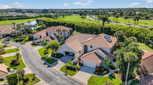 an aerial view of a house with outdoor space