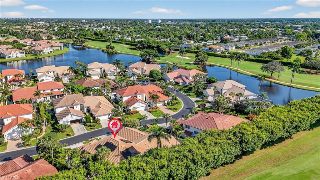 2193 Paget Circle, Unit 1 25 Naples, FL 34112 - Photo 39 of 50 an aerial view of lake and residential houses with outdoor space