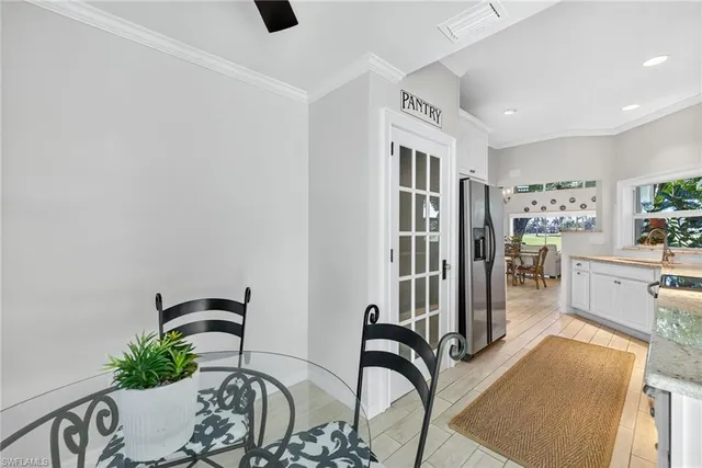 a bedroom with furniture and a potted plant