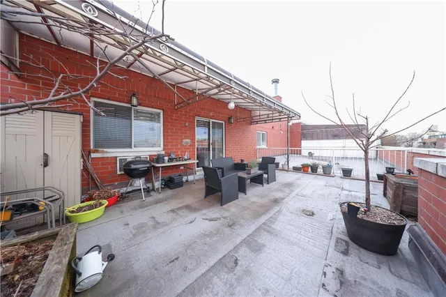 a backyard of a house with outdoor seating