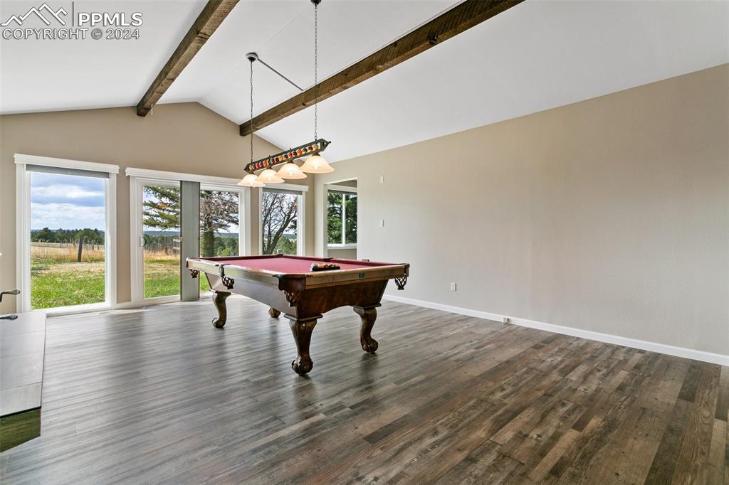 12990 Mc Cune Road Elbert, CO 80106 - Photo 20 of 50 a view of a dining room with furniture window and wooden floor