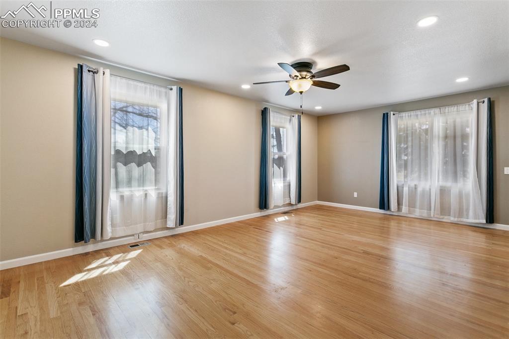 12990 Mc Cune Road Elbert, CO 80106 - Photo 23 of 50 a view of an empty room with window and wooden floor