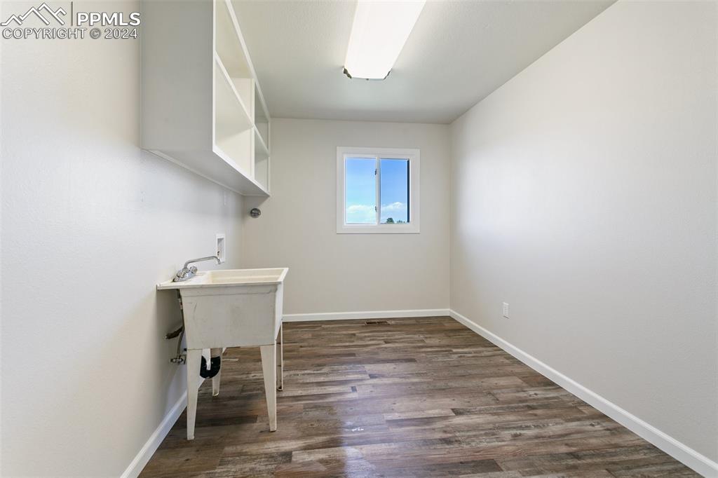 12990 Mc Cune Road Elbert, CO 80106 - Photo 30 of 50 a room with a sink and cabinets
