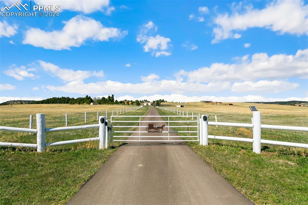 12990 Mc Cune Road Elbert, CO 80106 - Photo 3 of 50 View of gate featuring a rural view and a yard