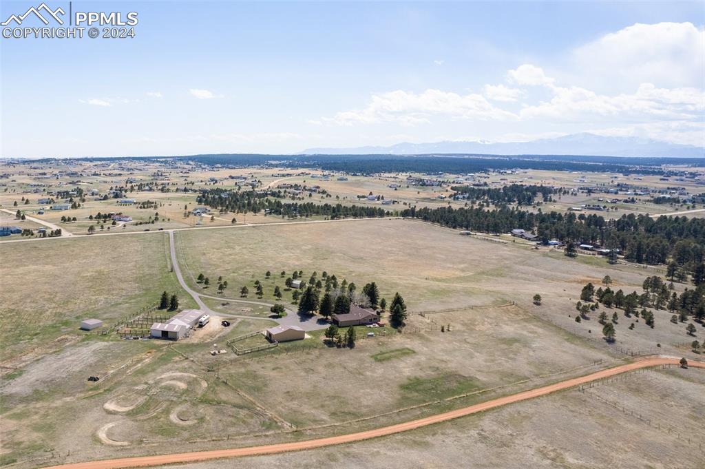 12990 Mc Cune Road Elbert, CO 80106 - Photo 41 of 50 an aerial view of a house with a yard and ocean view