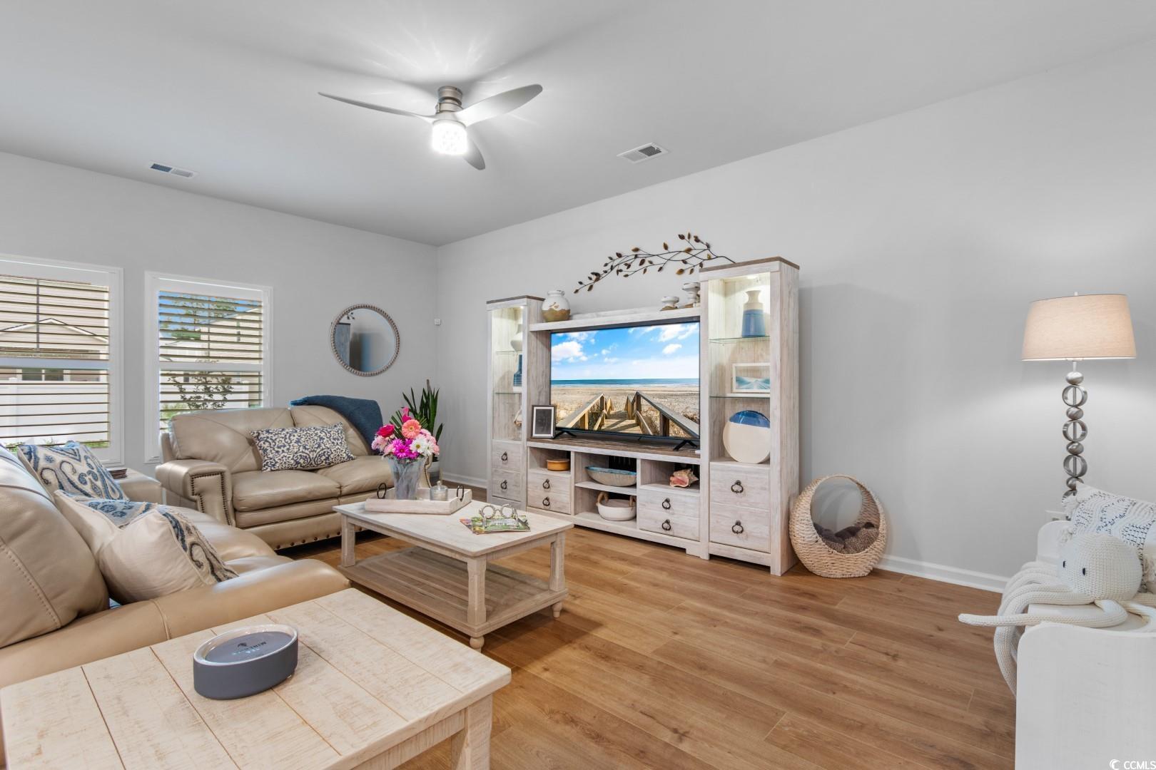 1075 Saltgrass Way Myrtle Beach, SC 29588 - Photo 9 of 40 Living room with hardwood / wood-style flooring an