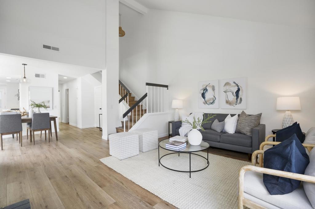 803 Skysail Avenue Carlsbad, CA 92011 - Photo 1 of 15 a living room with furniture and wooden floor