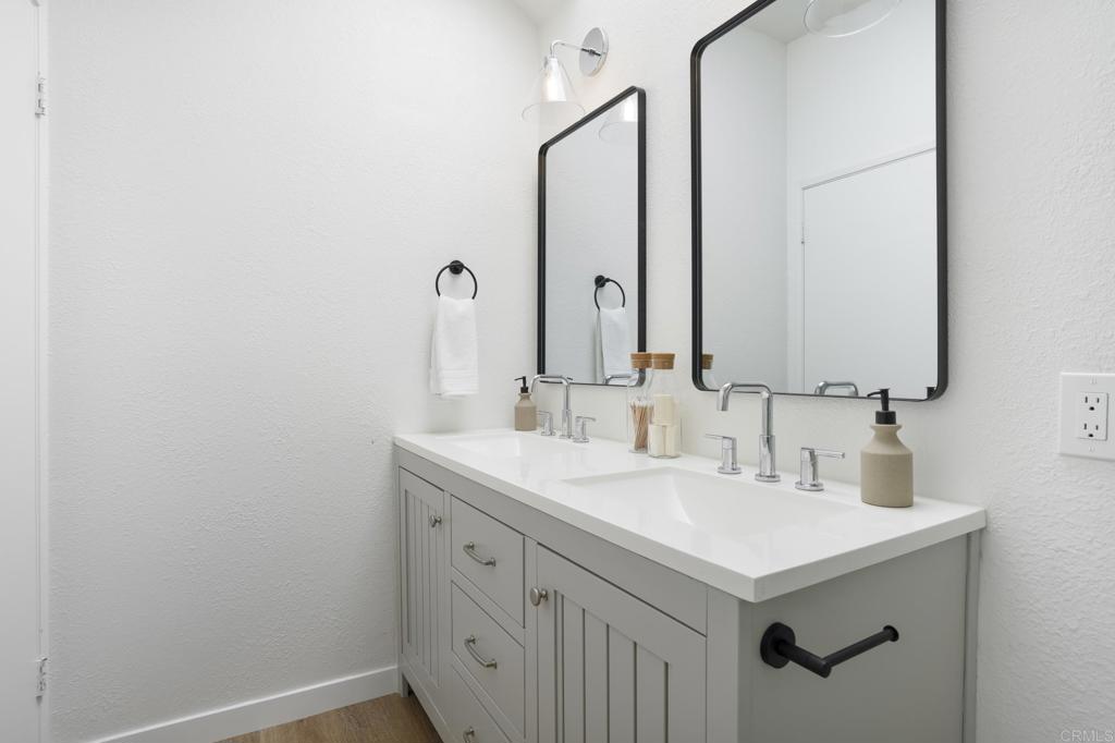 803 Skysail Avenue Carlsbad, CA 92011 - Photo 11 of 15 a bathroom with a sink and a mirror
