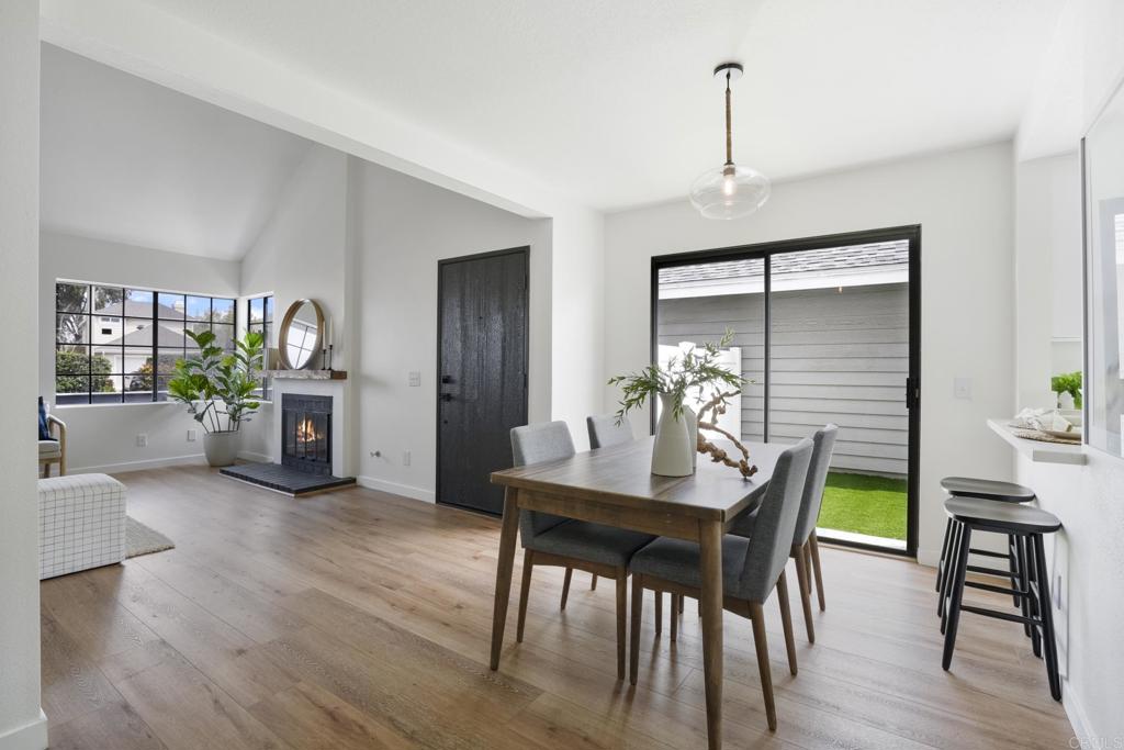 803 Skysail Avenue Carlsbad, CA 92011 - Photo 4 of 15 a view of a dining room with furniture window and wooden floor