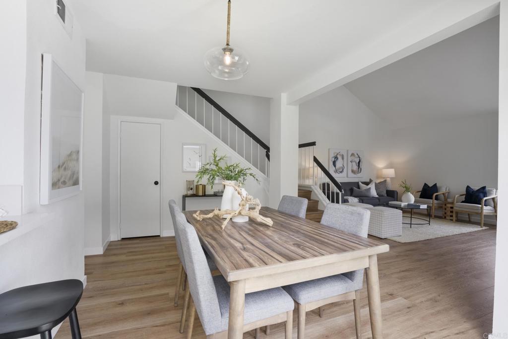 803 Skysail Avenue Carlsbad, CA 92011 - Photo 5 of 15 a view of a dining room with furniture and wooden floor