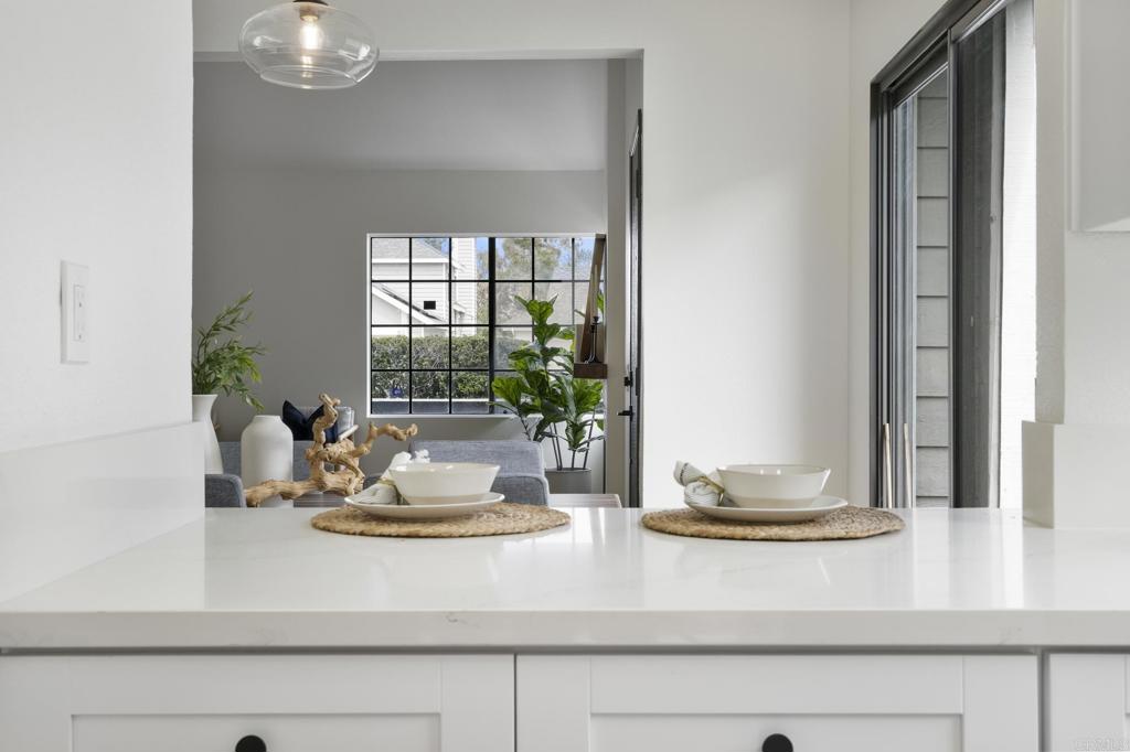 803 Skysail Avenue Carlsbad, CA 92011 - Photo 8 of 15 a view of a dining table with a potted plant