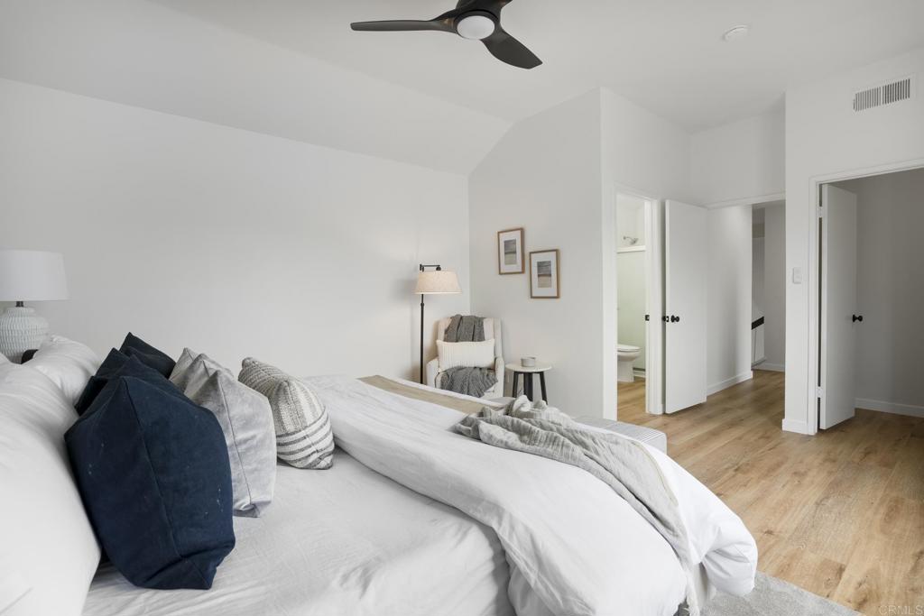 803 Skysail Avenue Carlsbad, CA 92011 - Photo 10 of 15 a bedroom with a bed and a dresser