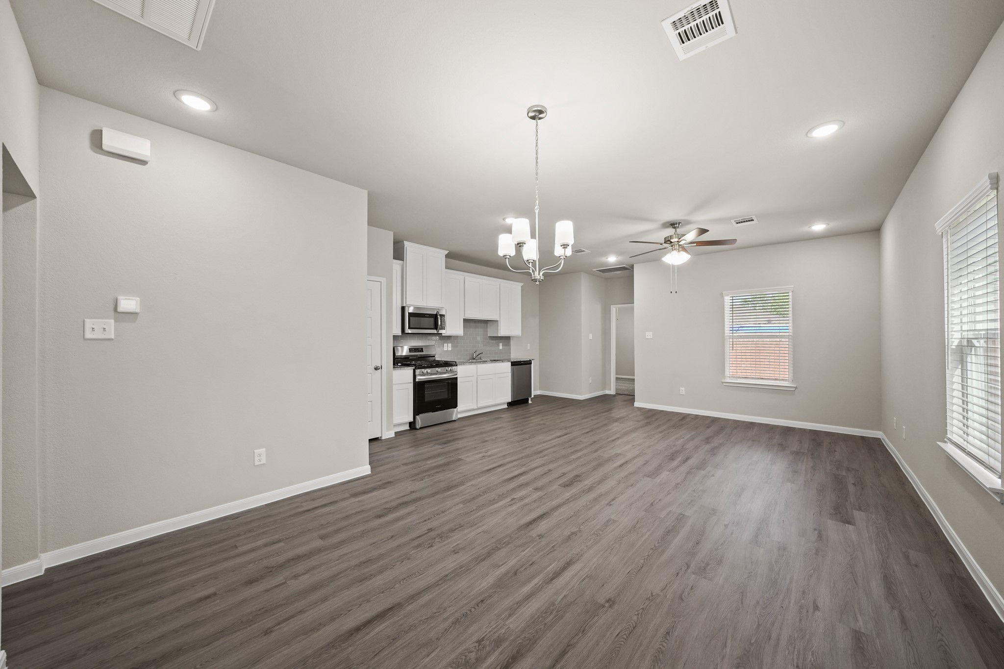 15025 Alkay Street Houston, TX 77053 - Photo 3 of 11 wooden floor in an empty room with a window