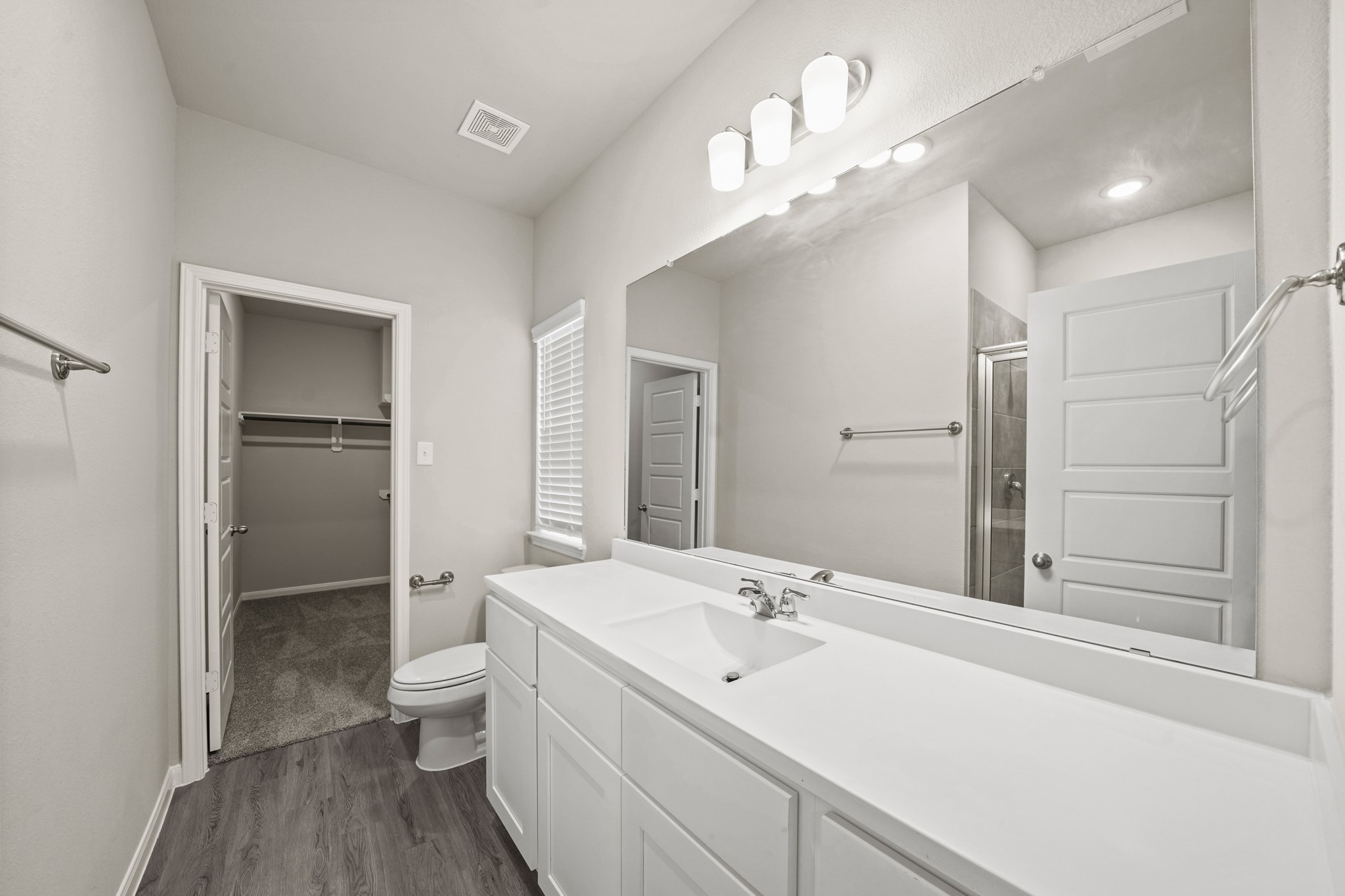 15025 Alkay Street Houston, TX 77053 - Photo 6 of 11 a bathroom with a double vanity sink mirror and toilet