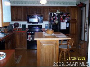 204 Mt Tabor Road Staunton, VA 24401 - Photo 8 of 12 a kitchen with a refrigerator and a stove top oven