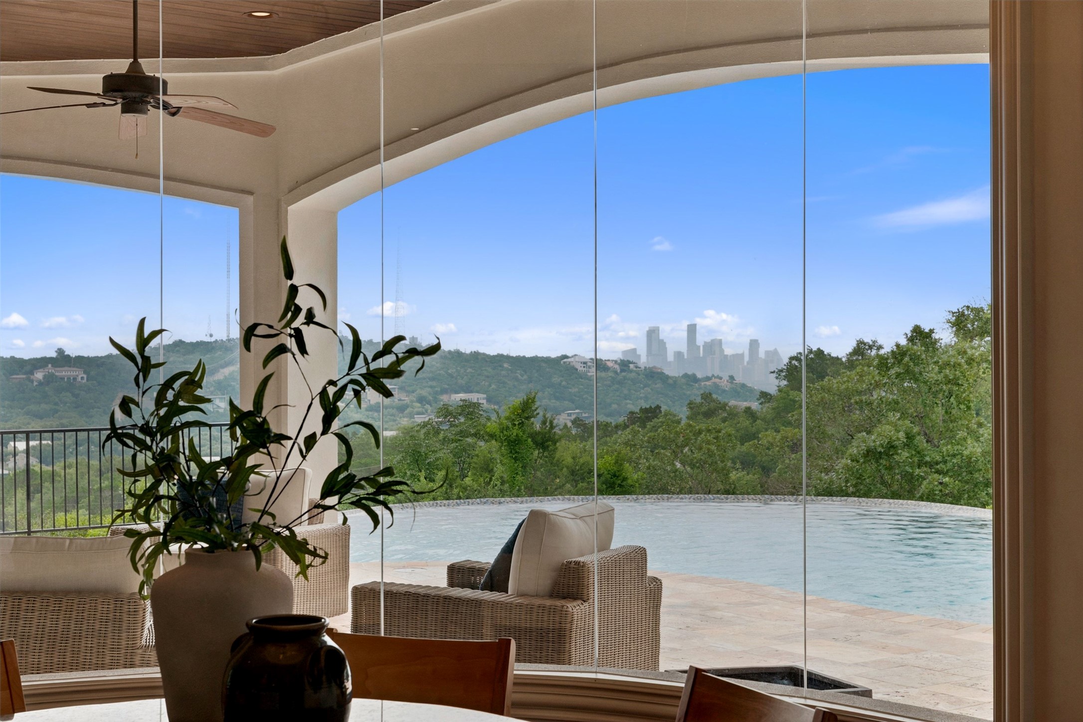 1414 The High Road Austin, TX 78746 - Photo 16 of 40 Infinite vistas await from this terrace, merging seamlessly with a captivating infinity pool.
