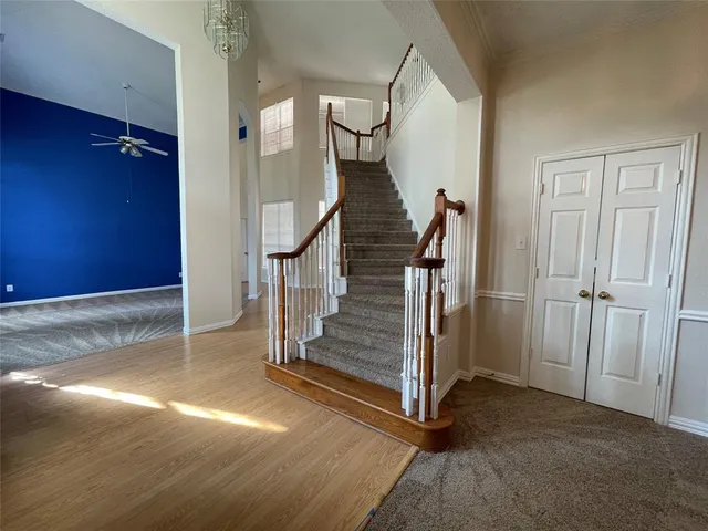 a view of a hallway with staircase