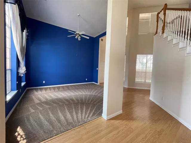 a view of livingroom with hardwood floor and hallway