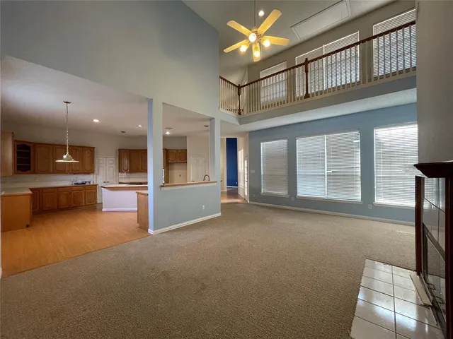 a view of a livingroom with kitchen and furniture