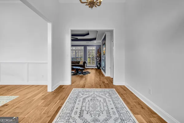 a view of a living room and bedroom