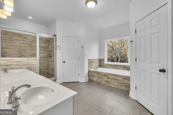 a bathroom with a bathtub and a sink