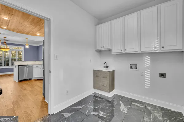 a view of kitchen with furniture and wooden floor