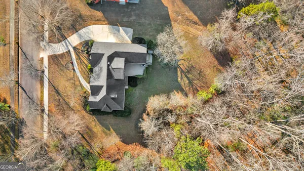 a aerial view of a house with a yard