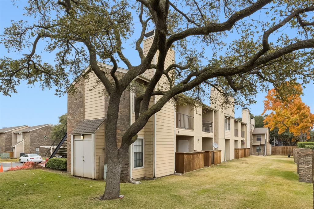 4748 Old Bent Tree Lane, Unit 1808 Dallas, TX 75287 - Photo 23 of 28 a large tree in front of a white house