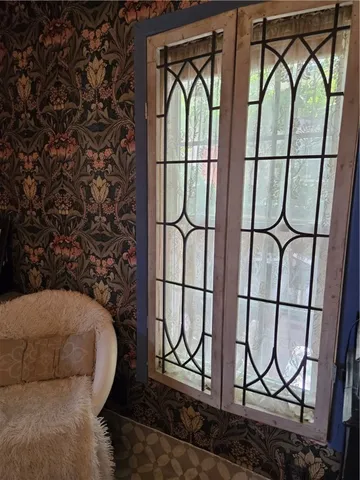 a front view of a house with a sink and a mirror