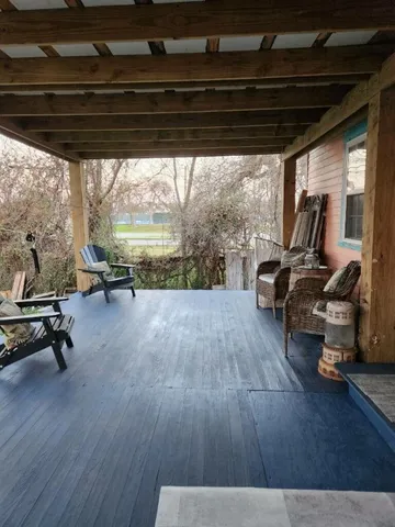 a view of a garden with wooden fence