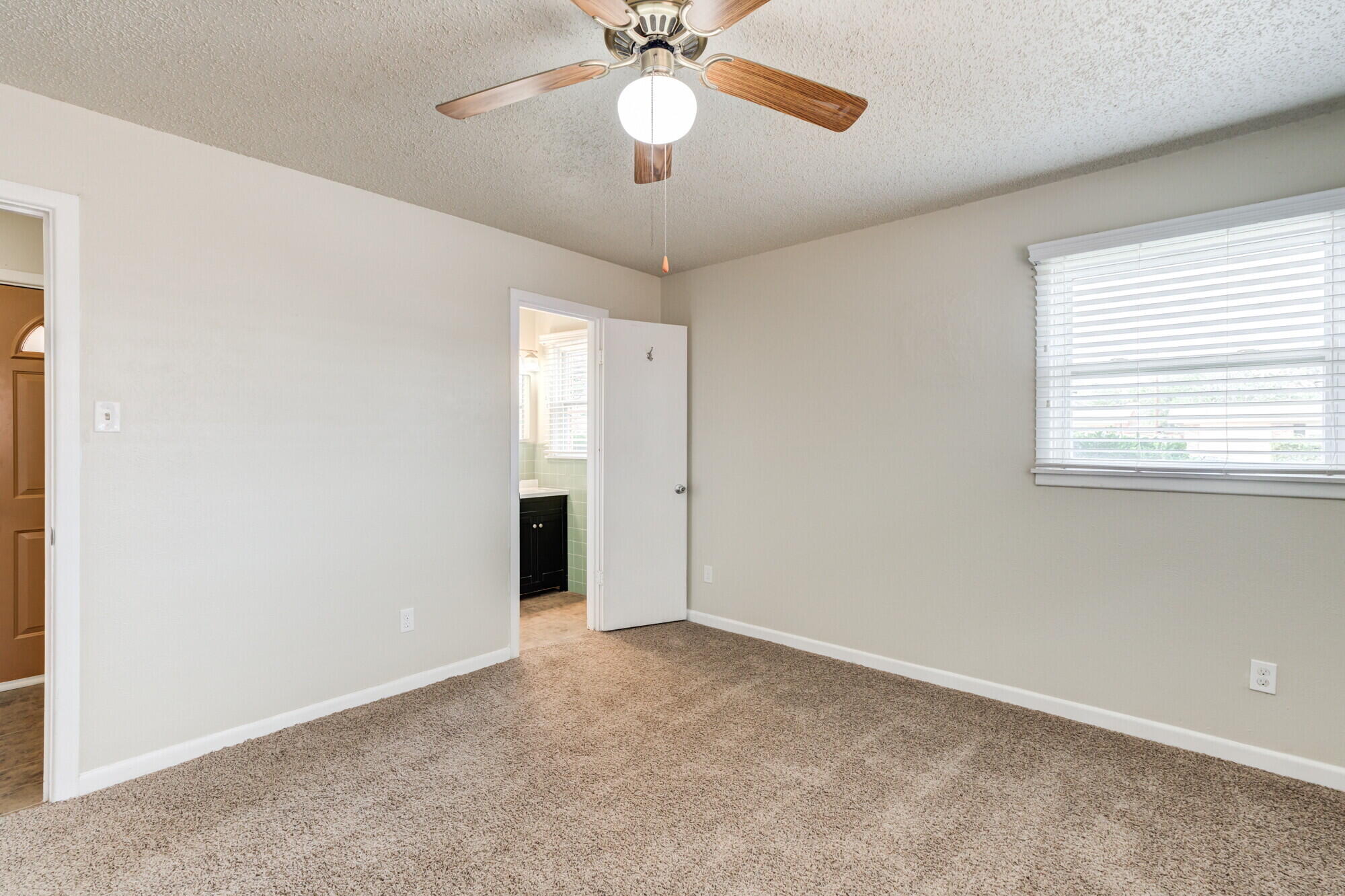 5017 46th Street Lubbock, TX 79414 - Photo 16 of 32 a view of an empty room with a window