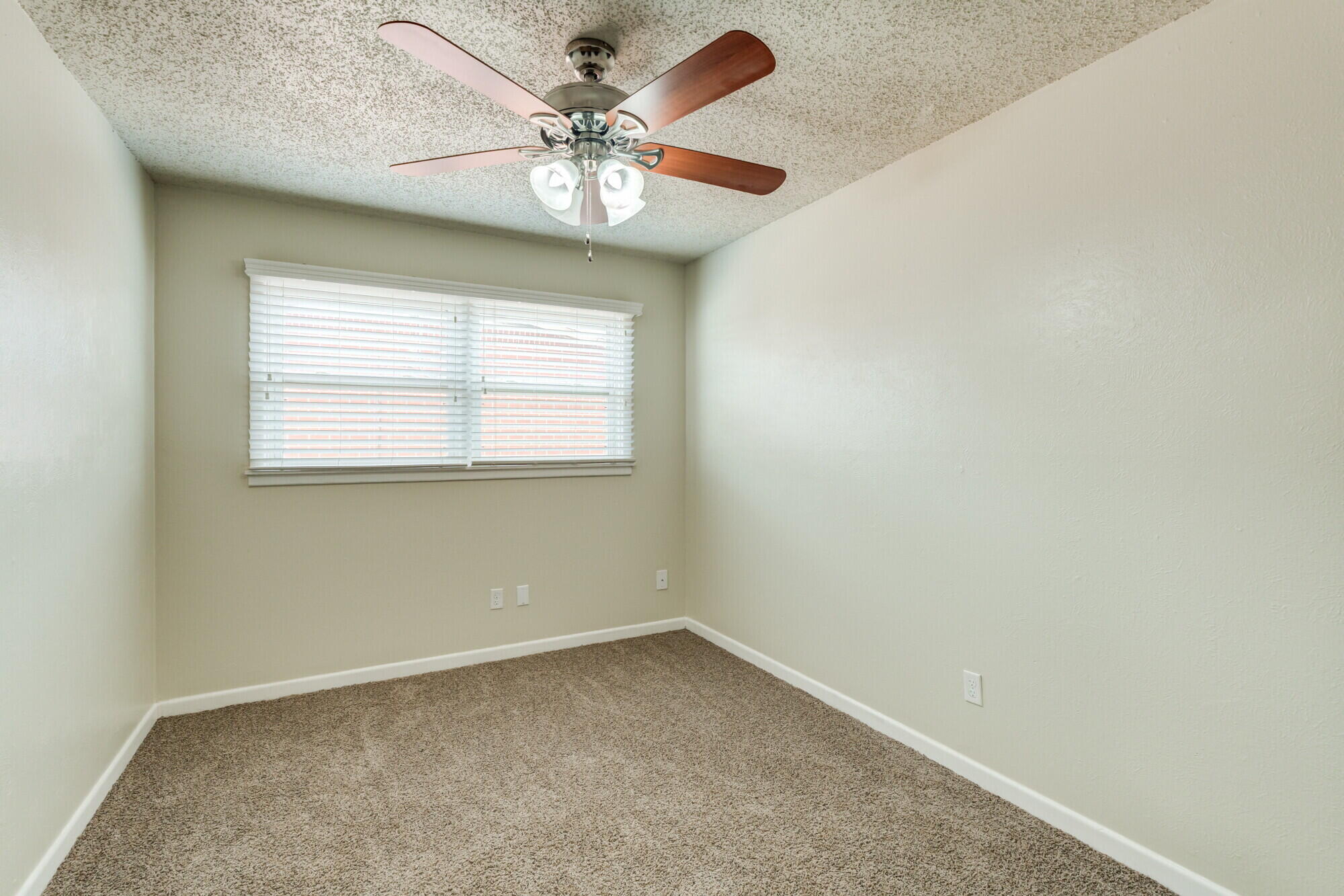 5017 46th Street Lubbock, TX 79414 - Photo 24 of 32 an empty room with a window