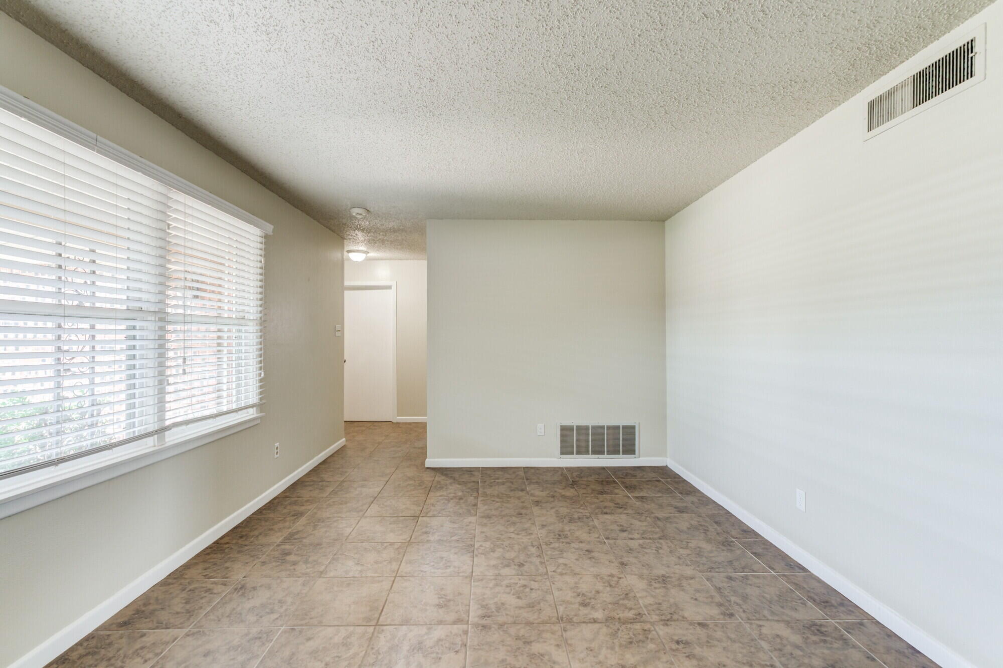 5017 46th Street Lubbock, TX 79414 - Photo 25 of 32 a view of an empty room with a window