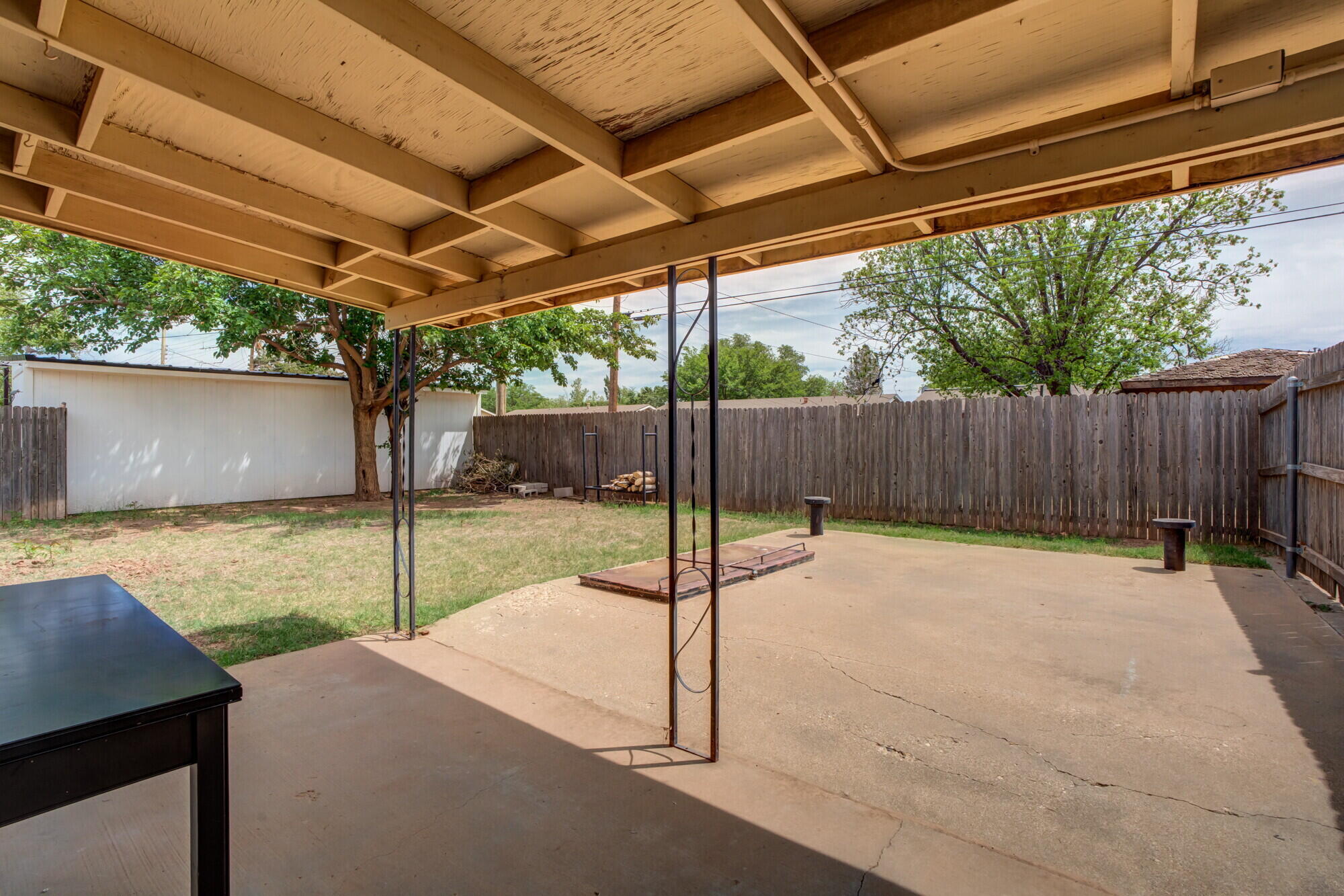 5017 46th Street Lubbock, TX 79414 - Photo 30 of 32 a view of a backyard with wooden fence