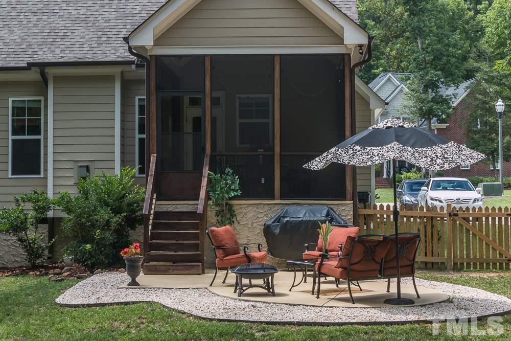 3429 Griffice Mill Road Raleigh, NC 27610 - Photo 23 of 25 a view of a house with backyard porch and sitting area