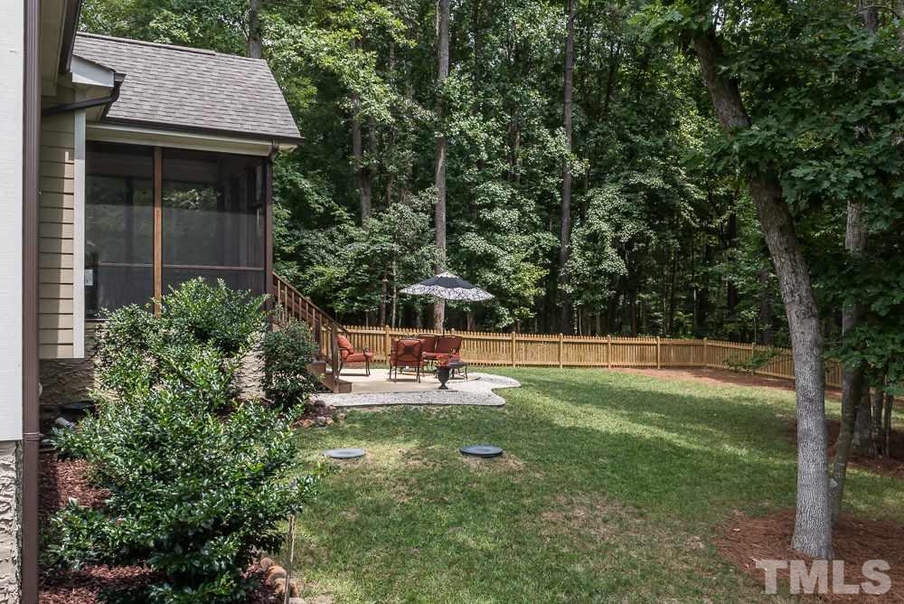 3429 Griffice Mill Road Raleigh, NC 27610 - Photo 24 of 25 a view of a house with a yard patio and sitting area