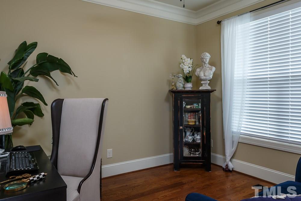 3429 Griffice Mill Road Raleigh, NC 27610 - Photo 4 of 25 a view of a workspace with furniture and wooden floor