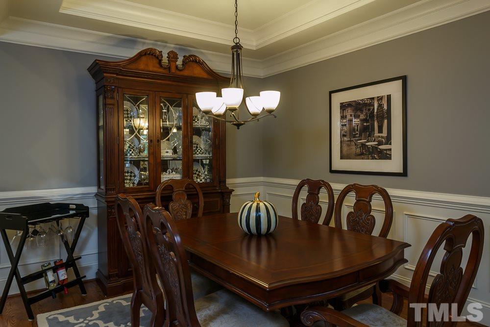 3429 Griffice Mill Road Raleigh, NC 27610 - Photo 7 of 25 a view of a dining room with furniture and chandelier