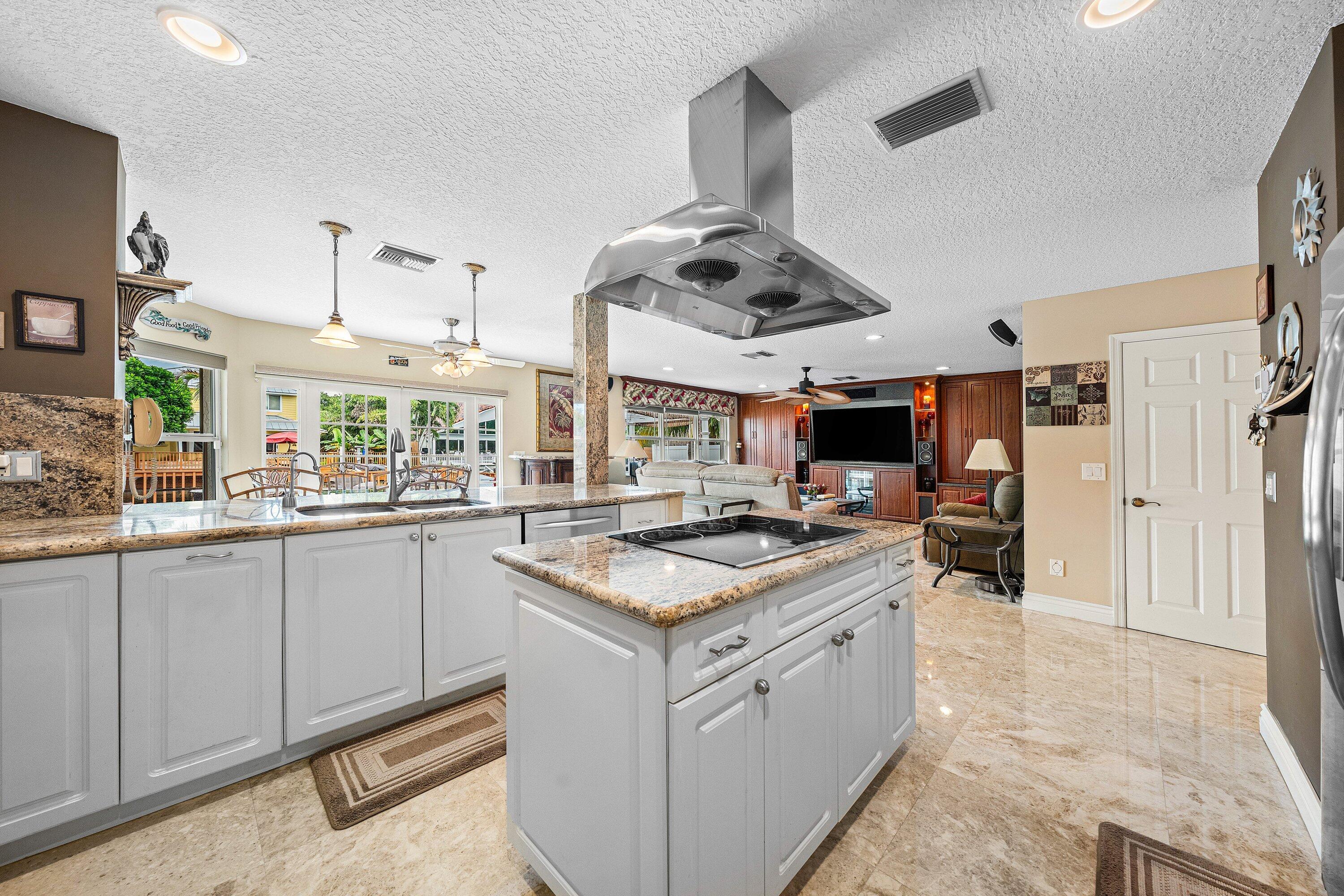 1548 Southwest 5th Avenue Boca Raton, FL 33432 - Photo 18 of 64 a kitchen with a stove and a sink