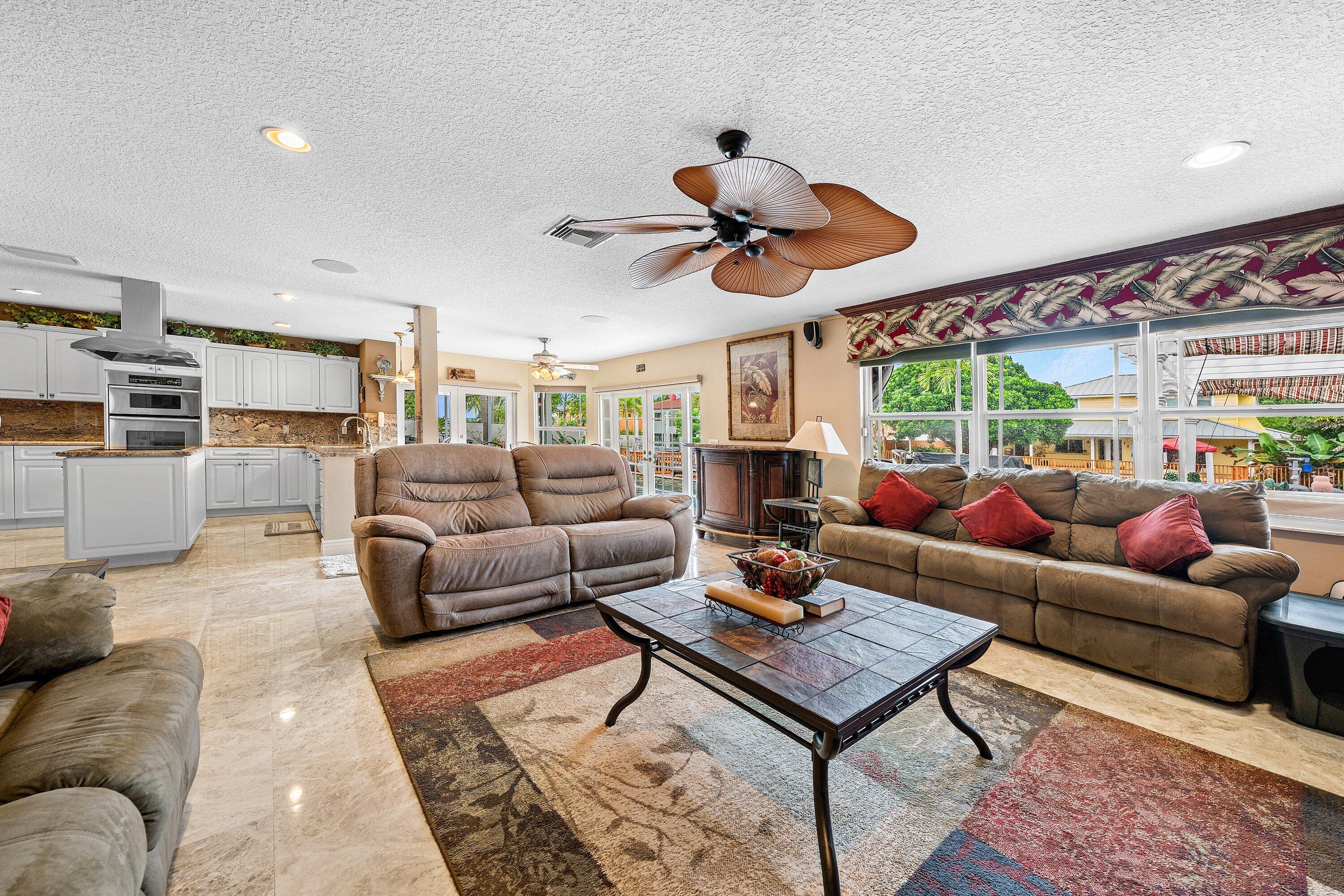 1548 Southwest 5th Avenue Boca Raton, FL 33432 - Photo 20 of 64 a living room with furniture kitchen view and a large window