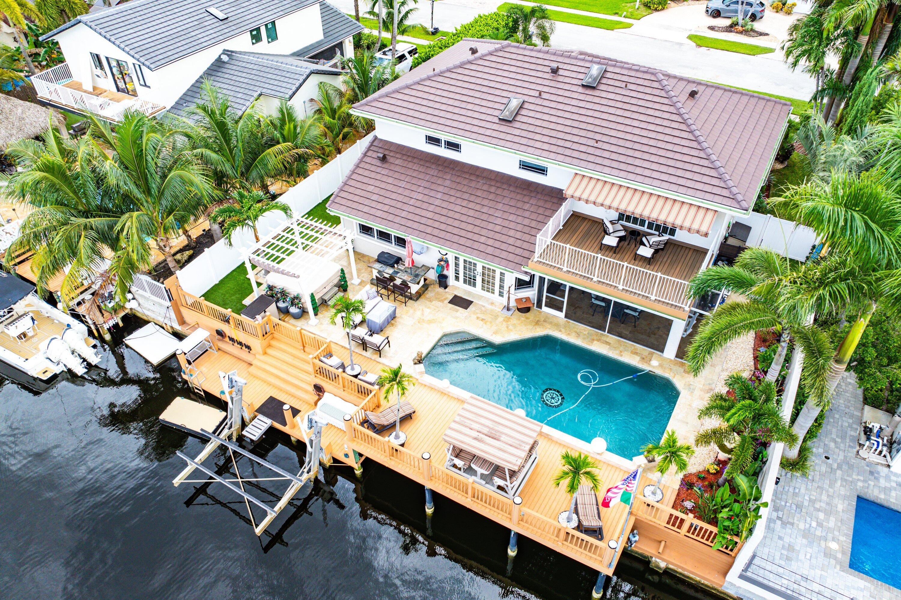 1548 Southwest 5th Avenue Boca Raton, FL 33432 - Photo 2 of 64 an aerial view of a house with a yard