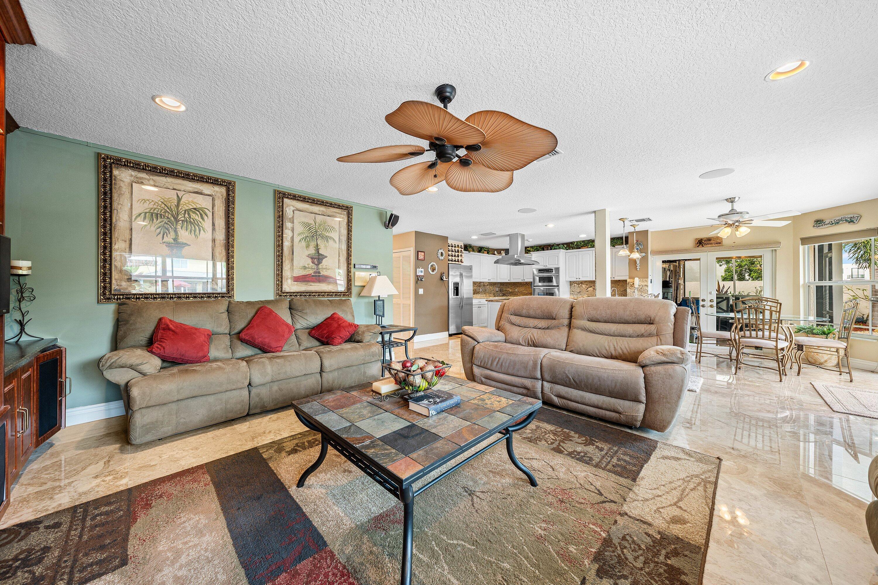 1548 Southwest 5th Avenue Boca Raton, FL 33432 - Photo 21 of 64 a living room with furniture kitchen view and a window
