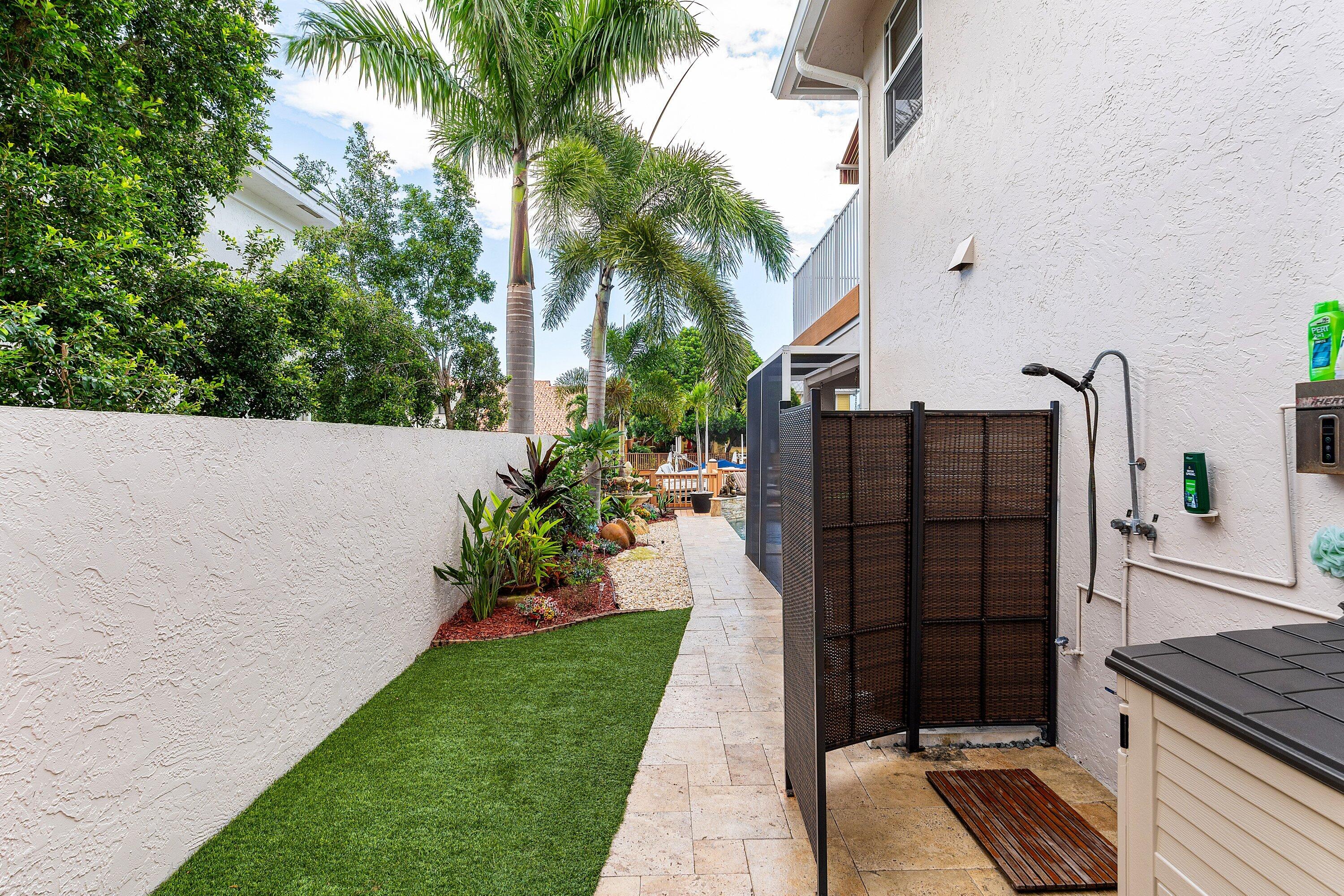 1548 Southwest 5th Avenue Boca Raton, FL 33432 - Photo 36 of 64 a view of a backyard with potted plants