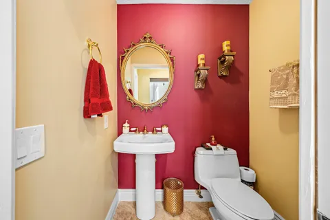 a kitchen with stainless steel appliances kitchen island granite countertop a refrigerator and a sink