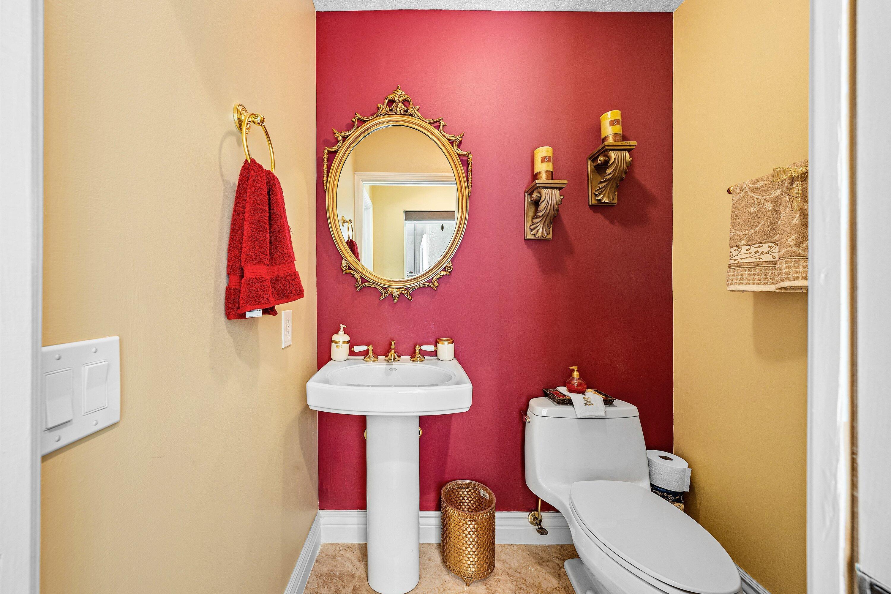 1548 Southwest 5th Avenue Boca Raton, FL 33432 - Photo 38 of 64 a bathroom with a toilet sink and mirror