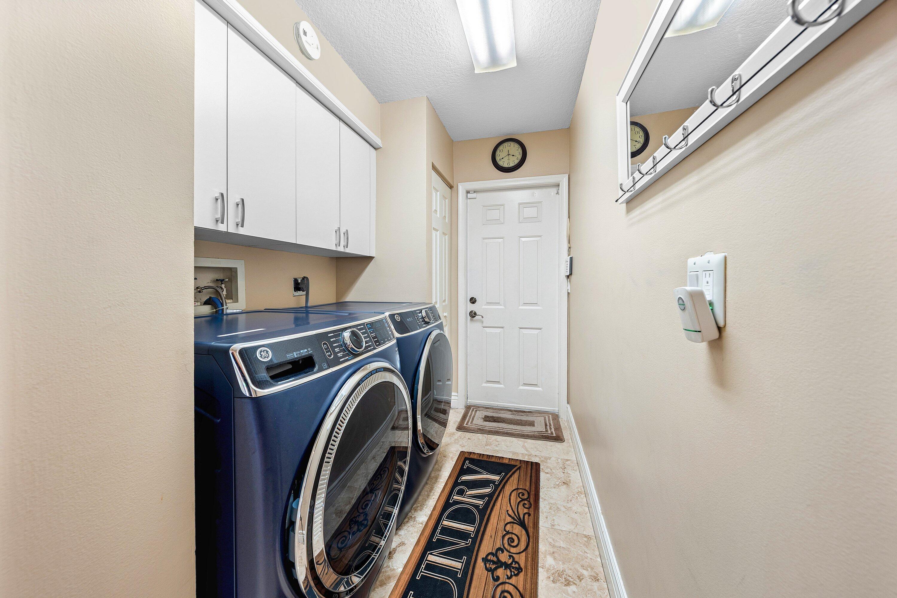 1548 Southwest 5th Avenue Boca Raton, FL 33432 - Photo 44 of 64 a view of storage and utility room with washer and dryer
