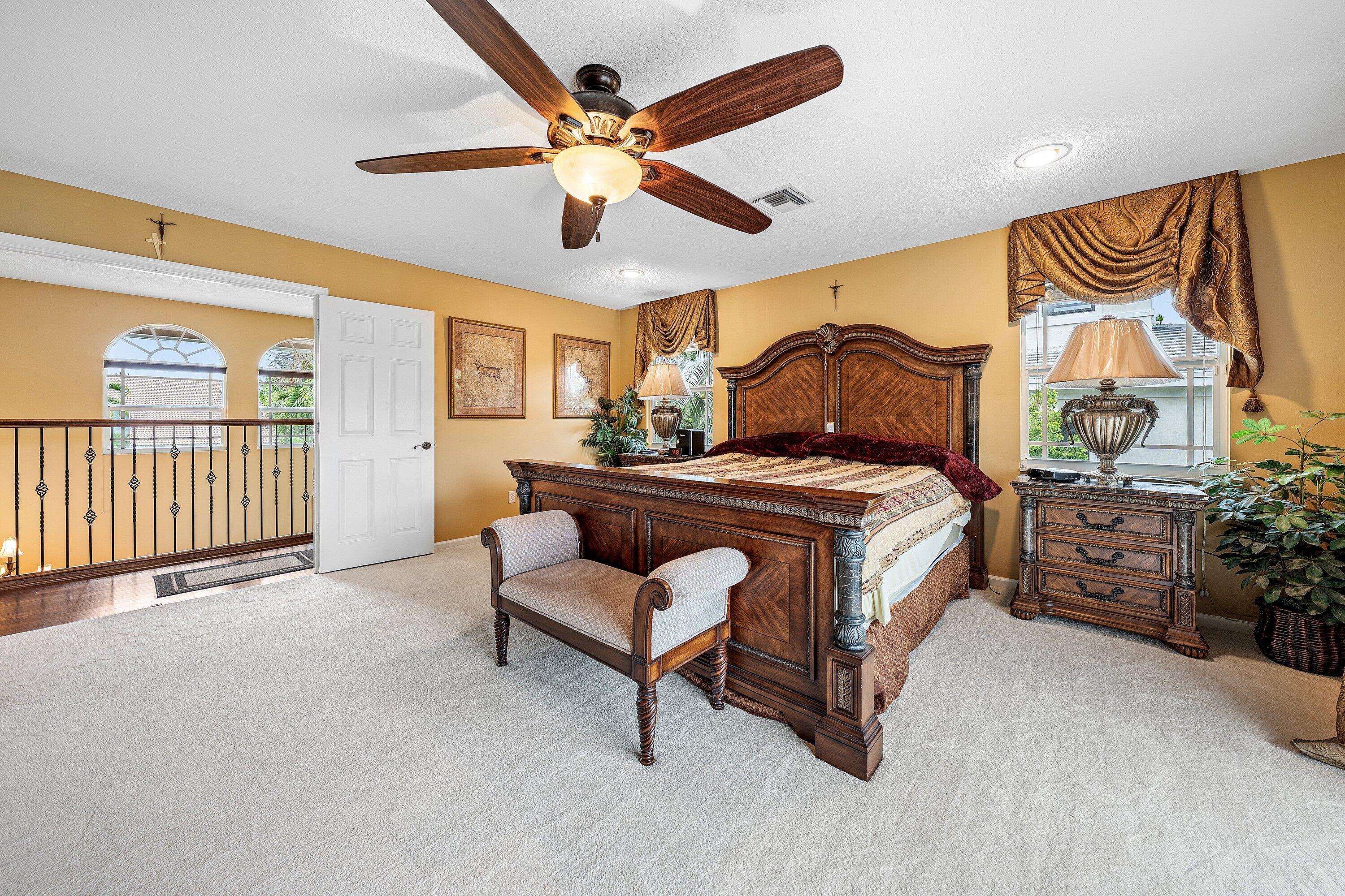 1548 Southwest 5th Avenue Boca Raton, FL 33432 - Photo 47 of 64 a bedroom with a bed and a large window